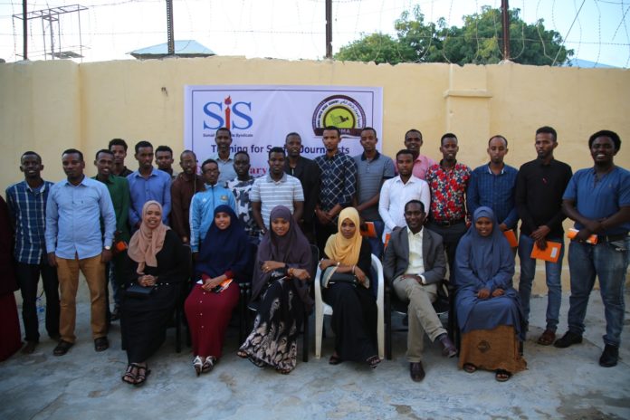 Journalists pose for a photo family after attending the first day of a two-week course of Documentary Storytelling in Mogadishu supported by Somali Journalists Syndicate (SJS) and Somali Digital Media Academy, Thursday 18 July, 2019.