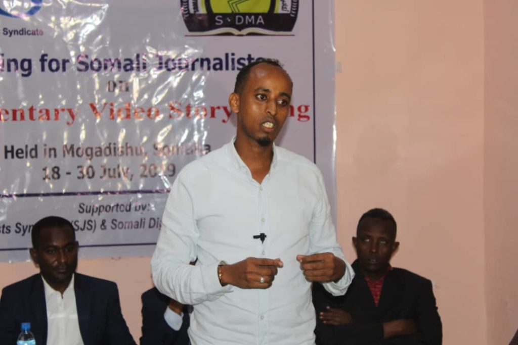  Guled Salad, a senior cameraman from Universal TV  speaks during the end of a two-week course on Documentary Video Storytelling in Mogadishu, on Thursday 8 August 2019. 