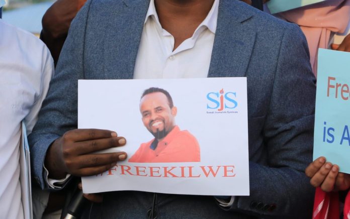 Kilwe portrait is held at a journalists' protest organized by SJS in Mogadishu in late January 2021. | PHOTO/SJS.