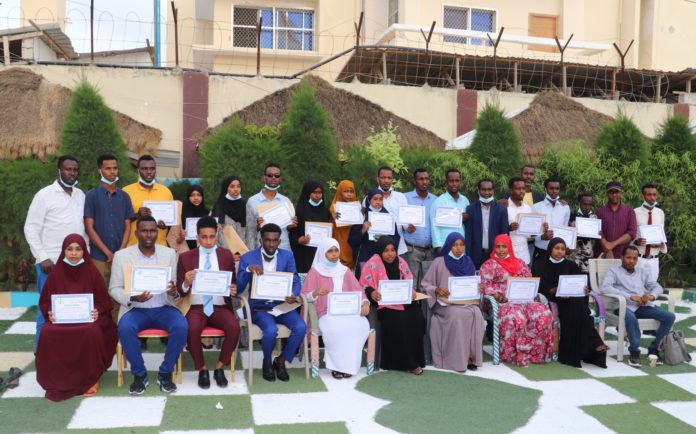 Journalists pose for a group photo at the end of three-day training supported by Canada Fund for Local Initiatives in Mogadishu