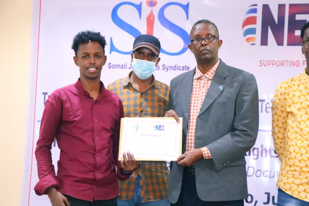 Radio Jubba journalist, Hussein Ali Ibrahim (first left) speaks at the conclusion of a three-day human rights journalism training in Kismayo, Thursday 23 September 2021. | PHOTO CREDIT/SJS.