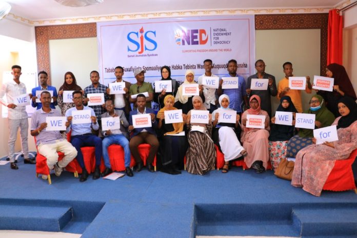 Journalists pose for a group photo at the conclusion of a three-day human rights journalism training in Garowe, Puntland.