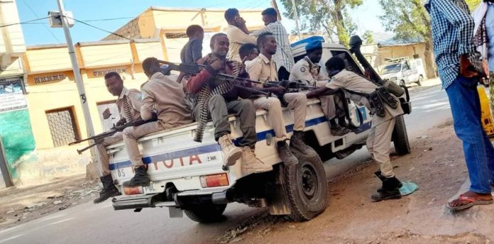 Police pick up truck carry journalists after a raid on Radio Hiiraan Weyn in Beledweyne on Friday