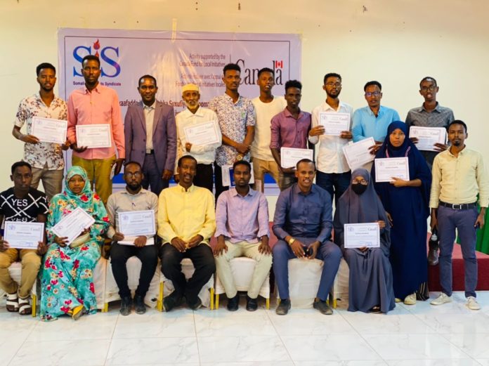 Journalists pose for a group photo after completing safety and media freedom training in Baidoa on 16 February, 2022.