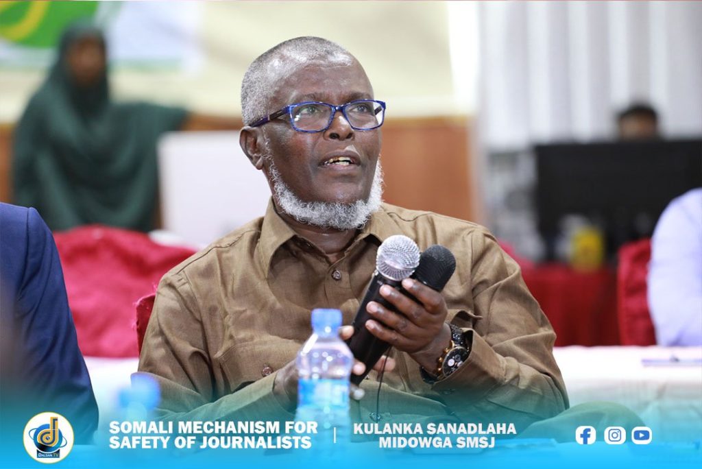 The Director-General of Federal Ministry of Information, Abdullahi Hayir Duale listens to the presentation of the SMSJ annual report at Jazeera Hotel, Mogadishu, Thursday 23 June, 2022. | PHOTO/Dalsan TV.