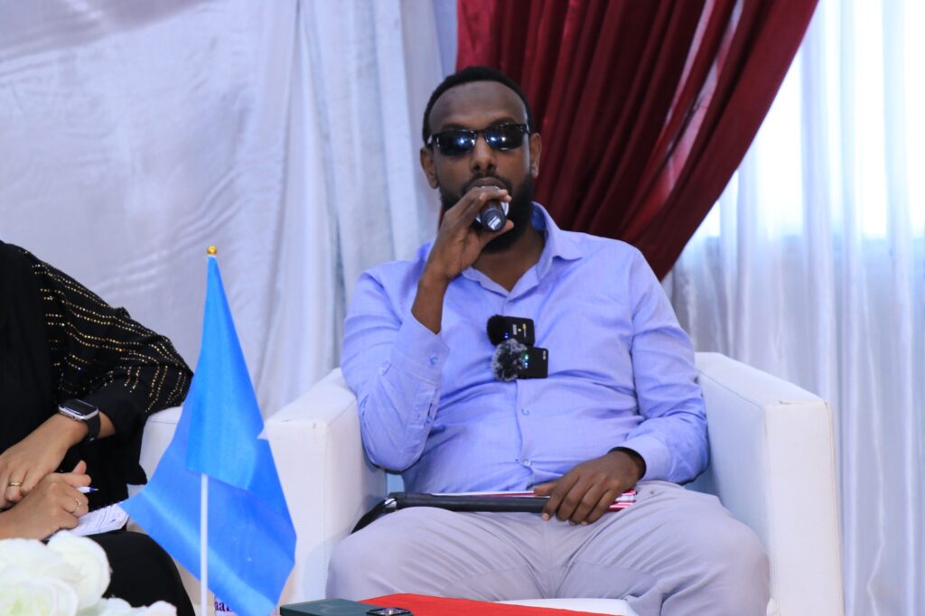 Mohamed Abdisalan Diriye, the Chairman of Somali Disability Empowerment Network, speaks during a panel discussion on human rights held in Mogadishu, Somalia on 10 December, 2023. |Photo/SJS.