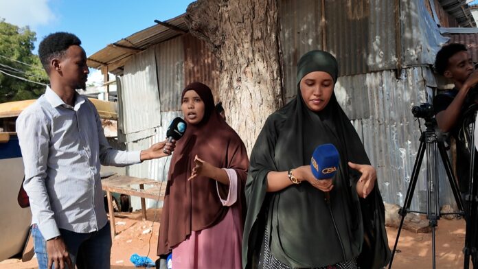 Journalists seen conducting interviews outside Warta Nabadda police station, Thursday 25 September, 2025. | PHOTO/Courtesy.