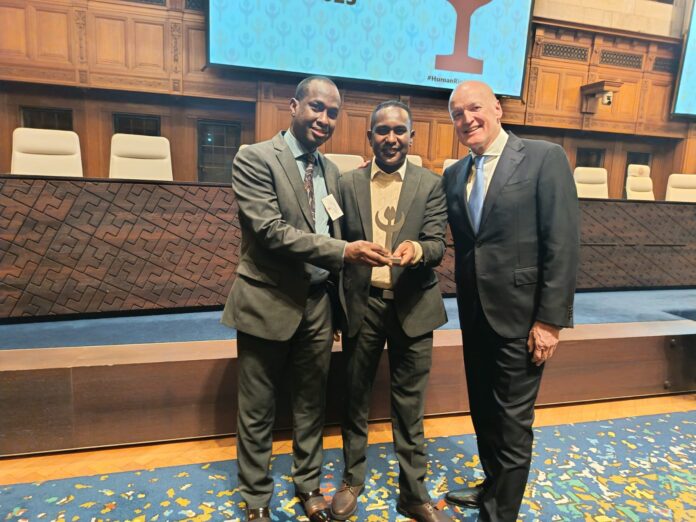 SJS President Mohamed Ibrahim and Secretary General Abdalle Mumin celebrate with Netherlands Human Rights Ambassador Wim Geerts during the Tulip Award reception at the Peace Palace in The Hague, Netherlands, on December 10, 2025.